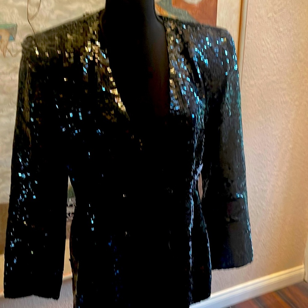 A vintage olec cassini woman’s sequin Blazer